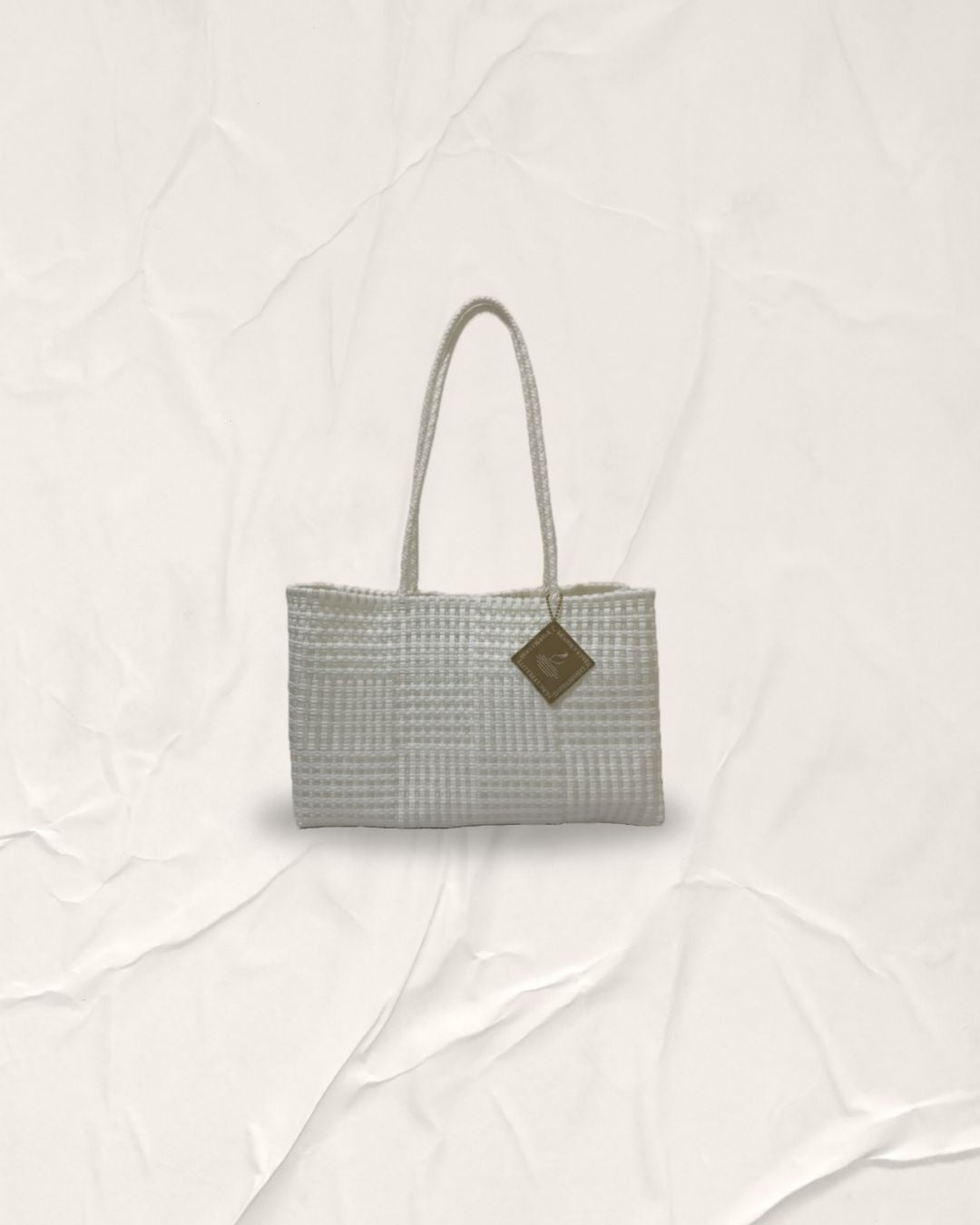 Satin Pearl and Calm White Padu Bag. A wider size silhouette hand-woven artisanal bag featuring a rhythmic horizontal and vertical grid pattern for emotional wellness and sustainable style.