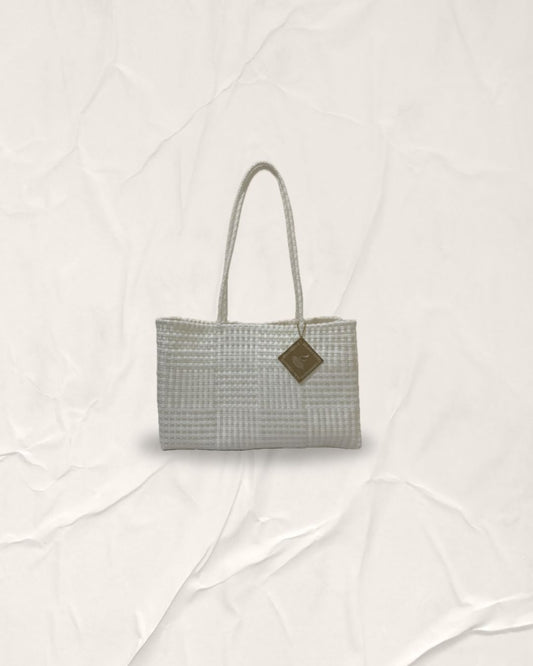 Satin Pearl and Calm White Padu Bag. A wider size silhouette hand-woven artisanal bag featuring a rhythmic horizontal and vertical grid pattern for emotional wellness and sustainable style.